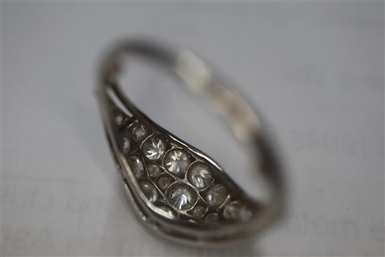 A white metal and diamond cluster set elliptical shaped ring, size H/I.